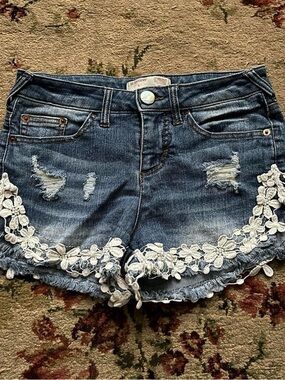 No Boundaries distressed floral lace embellished jean shorts